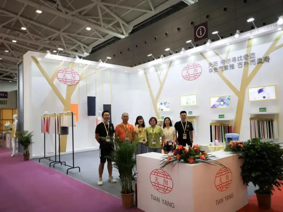 Tianyang team at booth 14E118 during a hosiery textile exhibition